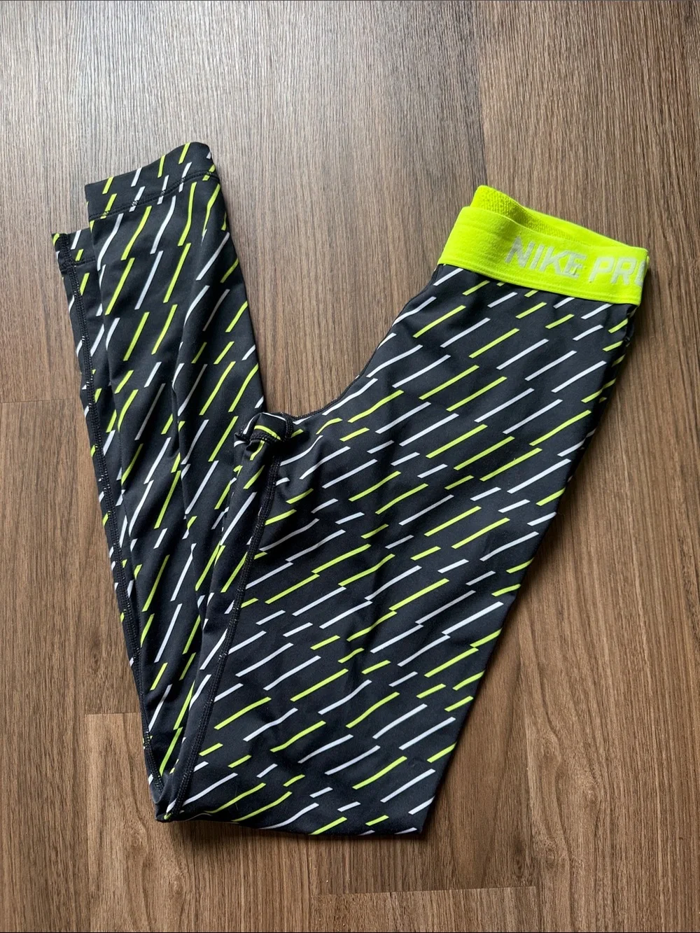 Nike Black Leggings with Neon Yellow and White Dash Pattern